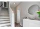 Modern entryway featuring a staircase and decorative mirror, with contemporary finishes at 1226 Chelsea Nw Cir, Atlanta, GA 30318