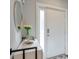 Modern entryway with contemporary decor, featuring a mirror and tulip arrangement at 1226 Chelsea Nw Cir, Atlanta, GA 30318