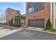 Modern townhome exterior with a private garage and manicured landscaping, offering an inviting curb appeal at 1226 Chelsea Nw Cir, Atlanta, GA 30318