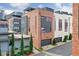 Contemporary townhome exterior featuring a blend of brick and siding, complete with a private garage at 1226 Chelsea Nw Cir, Atlanta, GA 30318