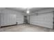 Spacious garage featuring storage cabinets and a convenient garage door, perfect for organization at 1226 Chelsea Nw Cir, Atlanta, GA 30318