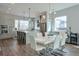 Bright kitchen and dining area features stainless steel appliances, bar seating, and modern lighting fixtures at 1226 Chelsea Nw Cir, Atlanta, GA 30318