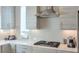 Stylish kitchen with stainless steel appliances, modern cabinets, and a light tile backsplash behind the stove at 1226 Chelsea Nw Cir, Atlanta, GA 30318