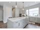 Spacious kitchen with a center island featuring a white countertop, pendant lights, and modern cabinets at 1226 Chelsea Nw Cir, Atlanta, GA 30318