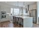 Modern kitchen features stainless steel appliances, a center island with seating, and hardwood flooring at 1226 Chelsea Nw Cir, Atlanta, GA 30318