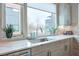 Bright kitchen counter featuring an undermount sink, modern faucet, and a view of the surrounding neighborhood at 1226 Chelsea Nw Cir, Atlanta, GA 30318