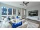 Open living room featuring a large sectional sofa, hardwood floors, and oversized television for seamless entertaining at 1226 Chelsea Nw Cir, Atlanta, GA 30318