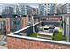 Spacious rooftop patio featuring a dining table, comfortable lounge seating, and artificial turf for a low-maintenance outdoor space at 1226 Chelsea Nw Cir, Atlanta, GA 30318