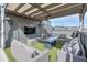 Relaxing rooftop patio featuring a fire pit, comfortable seating, a TV, and artificial turf for easy maintenance at 1226 Chelsea Nw Cir, Atlanta, GA 30318