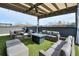 Comfortable rooftop patio with a seating area, fire pit, and artificial turf, perfect for outdoor living and entertaining at 1226 Chelsea Nw Cir, Atlanta, GA 30318