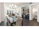 Elegant dining area adjacent to modern kitchen, with stylish lighting and easy access to a convenient powder room at 2353 Medlock Ln, Decatur, GA 30033