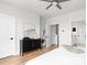 Bright bedroom featuring a ceiling fan, black dresser, and doorways to other rooms at 332 Gibson Street Southeast Se St, Atlanta, GA 30316