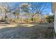 Expansive backyard with mature trees providing shade and privacy at 3619 Ponderosa Ln, Powder Springs, GA 30127