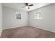 Bright, empty bedroom with neutral walls and carpet, ceiling fan and lots of natural light at 3619 Ponderosa Ln, Powder Springs, GA 30127