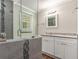 Bathroom showcasing a tiled walk-in shower and vanity at 1743 Thomas Ter, Decatur, GA 30032