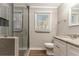 Bathroom featuring a tiled walk-in shower and vanity at 1743 Thomas Ter, Decatur, GA 30032