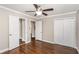 Spacious bedroom with hardwood floors, neutral paint, and a ceiling fan, offering ample closet space at 1743 Thomas Ter, Decatur, GA 30032