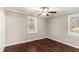 Bedroom featuring hardwood floors, neutral paint, a ceiling fan, and a bright and airy atmosphere at 1743 Thomas Ter, Decatur, GA 30032
