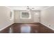 Bright living room featuring hardwood floors, white trim, neutral walls, and natural light from large windows at 1743 Thomas Ter, Decatur, GA 30032