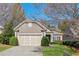 Single Gathering home with a manicured lawn, blue skies, and lovely landscaping at 4460 Cadmium Dr, Cumming, GA 30040