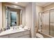 Bathroom with a shower-tub combo, white cabinets, and chrome hardware at 857 Stovall Ne Pl, Atlanta, GA 30342