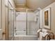 Bathroom with a shower-tub combo and white tile at 857 Stovall Ne Pl, Atlanta, GA 30342