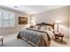 Bedroom with a queen-sized bed, side tables, and neutral color palette at 857 Stovall Ne Pl, Atlanta, GA 30342