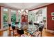 A modern dining room with a view into the living room, and an access door to the rear yard at 857 Stovall Ne Pl, Atlanta, GA 30342