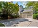 Lovely home exterior with a two-car garage, attractive landscaping, and a spacious driveway for parking at 857 Stovall Ne Pl, Atlanta, GA 30342