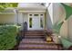 Close-up view of a home's front entrance, showcasing brick steps, iron railings and a stylish door at 857 Stovall Ne Pl, Atlanta, GA 30342