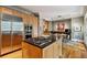Kitchen with stainless steel appliances, central island, and view into the dining and living room at 857 Stovall Ne Pl, Atlanta, GA 30342