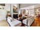 Comfortable living room with a marble fireplace, built-in shelving, and views into the foyer at 857 Stovall Ne Pl, Atlanta, GA 30342
