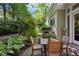 Inviting brick patio with a wooden dining set and lush green surroundings, perfect for outdoor entertaining at 857 Stovall Ne Pl, Atlanta, GA 30342