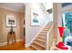 Bright staircase with wooden steps and white railing at 857 Stovall Ne Pl, Atlanta, GA 30342