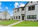 Beautiful new townhome with white brick and siding, dark trim, manicured lawn, and private residence sign at 1330 Parc Bench Rd, Atlanta, GA 30316