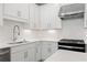 Clean kitchen featuring white cabinetry, quartz countertops, stainless steel appliances and hexagon backsplash at 1330 Parc Bench Rd, Atlanta, GA 30316