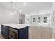 Open concept layout with a kitchen island in the foreground and the living area in the background at 1330 Parc Bench Rd, Atlanta, GA 30316