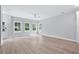 Bright living room with hardwood floors, neutral paint, lots of windows and a ceiling fan at 1330 Parc Bench Rd, Atlanta, GA 30316