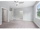 A spacious bedroom with carpet, light gray walls, a ceiling fan and an ensuite bathroom at 1330 Parc Bench Rd, Atlanta, GA 30316