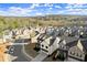 An aerial view showcases the well-planned community featuring new homes, landscaping, and street layout at 1590 Branthaven Ln, Auburn, GA 30011