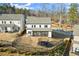 Backyard includes a fenced-in yard with a trampoline, a screened-in porch, and a view of the neighborhood street at 1590 Branthaven Ln, Auburn, GA 30011