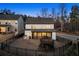 Spacious backyard features a fenced-in yard with a trampoline and a screened-in porch for outdoor entertaining at 1590 Branthaven Ln, Auburn, GA 30011