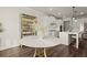 Breakfast nook with a marble table, a mirrored cabinet, and view into the kitchen at 1590 Branthaven Ln, Auburn, GA 30011