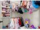 Bright closet features dual hanging rods, built-in shelving, and lots of storage space at 1590 Branthaven Ln, Auburn, GA 30011