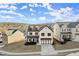 Stylish two-story home with neutral exterior, complemented by black accents and professional landscaping at 1590 Branthaven Ln, Auburn, GA 30011