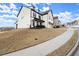 Lovely two-story home with a sloped lot and well-maintained landscaping at 1590 Branthaven Ln, Auburn, GA 30011