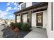 Charming front porch with wood columns and professionally landscaped garden at 1590 Branthaven Ln, Auburn, GA 30011