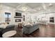 Spacious open floor plan features a living room with modern fireplace and an adjacent kitchen at 1590 Branthaven Ln, Auburn, GA 30011