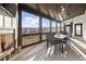 The covered patio includes an outdoor fireplace, modern seating, and a great view for relaxation and enjoyment at 1590 Branthaven Ln, Auburn, GA 30011