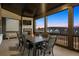 Screened patio featuring an outdoor fireplace, television, and ample seating, perfect for entertaining at 1590 Branthaven Ln, Auburn, GA 30011